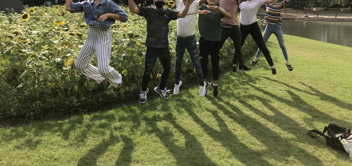 group of students jumping into the air